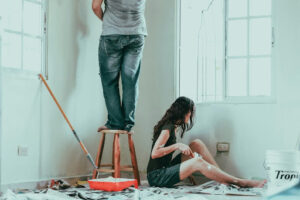 Two people following the home painting tips while renovating.